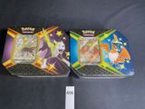 two pokemon trading cards are sitting on a table