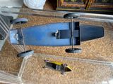 a toy car and a skateboard sitting on a table