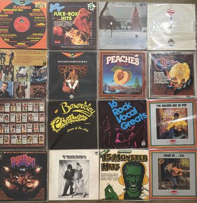 a lot of records on the wall of a room