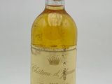 bottle of white wine with a moustache on the label