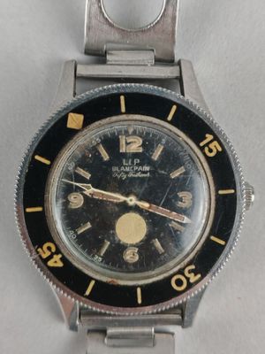 an image of a wrist watch with a black face and yellow hands