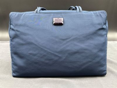 NINA RICCI. Sac à main en toile, de forme rectangulaire, couleur bleu 