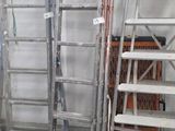 many ladders in a room with a lot of stuff on the floor