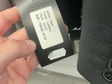 a person holding a business card in their hand