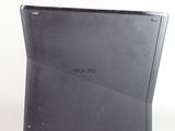 a close up of a laptop computer on a white surface