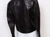 the back view of a mannequin mannequin wearing a black leather jacket