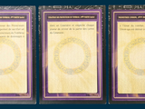 three cards that are sitting on top of each other