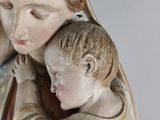 a statue of a woman holding a child in her arms
