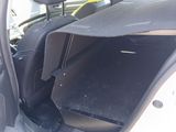 a car that has its door open with the seat down