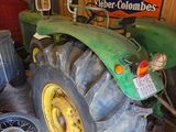 a tractor that is parked in a garage