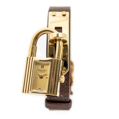 an image of a watch with a padlock attached to it