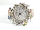 an image of a woman ' s wrist watch with multi colored stones