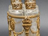 pair of clear glass salt and pepper shakers with gold trimming