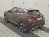 a car that is parked in a room with a checkered floor