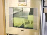 an oven that is built into the wall in the kitchen