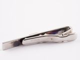 tie bar in the shape of a tie clip on a white background
