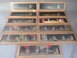 a lot of pictures on display in a display case