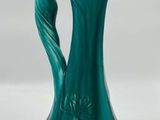 an image of a green vase on a white background