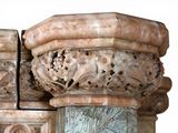 a close up of a stone pillar with carvings on it