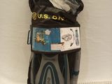 a mesh bag filled with various items on a white surface