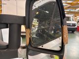 a side view mirror of a truck in a building