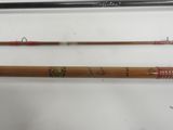 three different types of fishing rods are lined up on a table