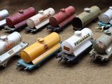 a lot of toy trains that are sitting on a table