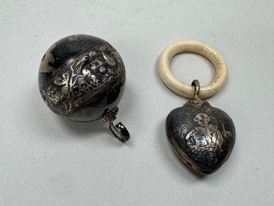 two pieces of jewelry that are on a table