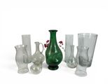 a lot of different glass vases and vases on the table