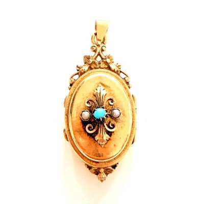 une image représentant une boucle d'oreille en or ornée d'une pierre turquoise au centre