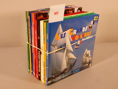 a lot of books that are stacked on top of each other