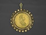 une image représentant une pièce d'or avec le visage d'une femme au centre
