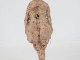 sculpture of a woman standing on a square base with a white background