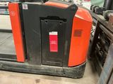 a forklift that is sitting in a warehouse