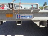 a trailer with a sign on the back of it