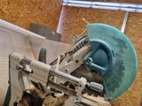 someone is using a circular saw to cut a piece of wood