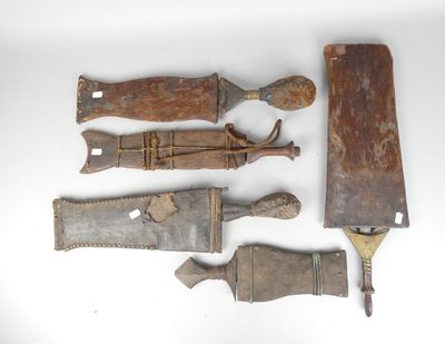 five different types of knives on a white surface