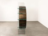 an image of a glass shelf in a room with a white wall