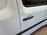 a white van with a black stripe on the side of it