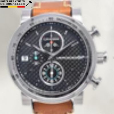 a close up of a watch with a leather strap