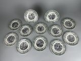 six plates with black and white designs are arranged in a circle
