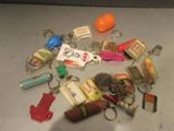 a pile of assorted keychains on a table