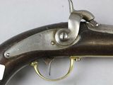 an old gun that is sitting on top of a table