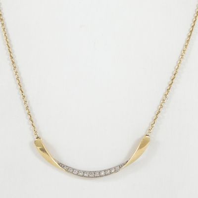a gold plated necklace with a curved bar with diamonds on it