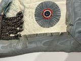 a blue and white bag with a red, white, and blue design on it