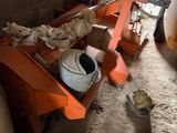 a small orange machine that is sitting in a room