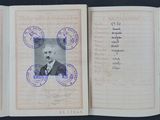 two pages of a passport with a picture of a man and a woman on them