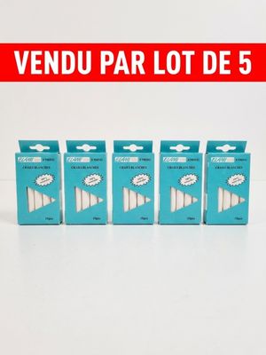 four boxes of toothbrushes sitting on top of a white surface