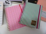 many different types of notebooks on a table