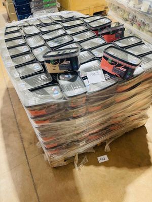 a large pile of books on a table in a room